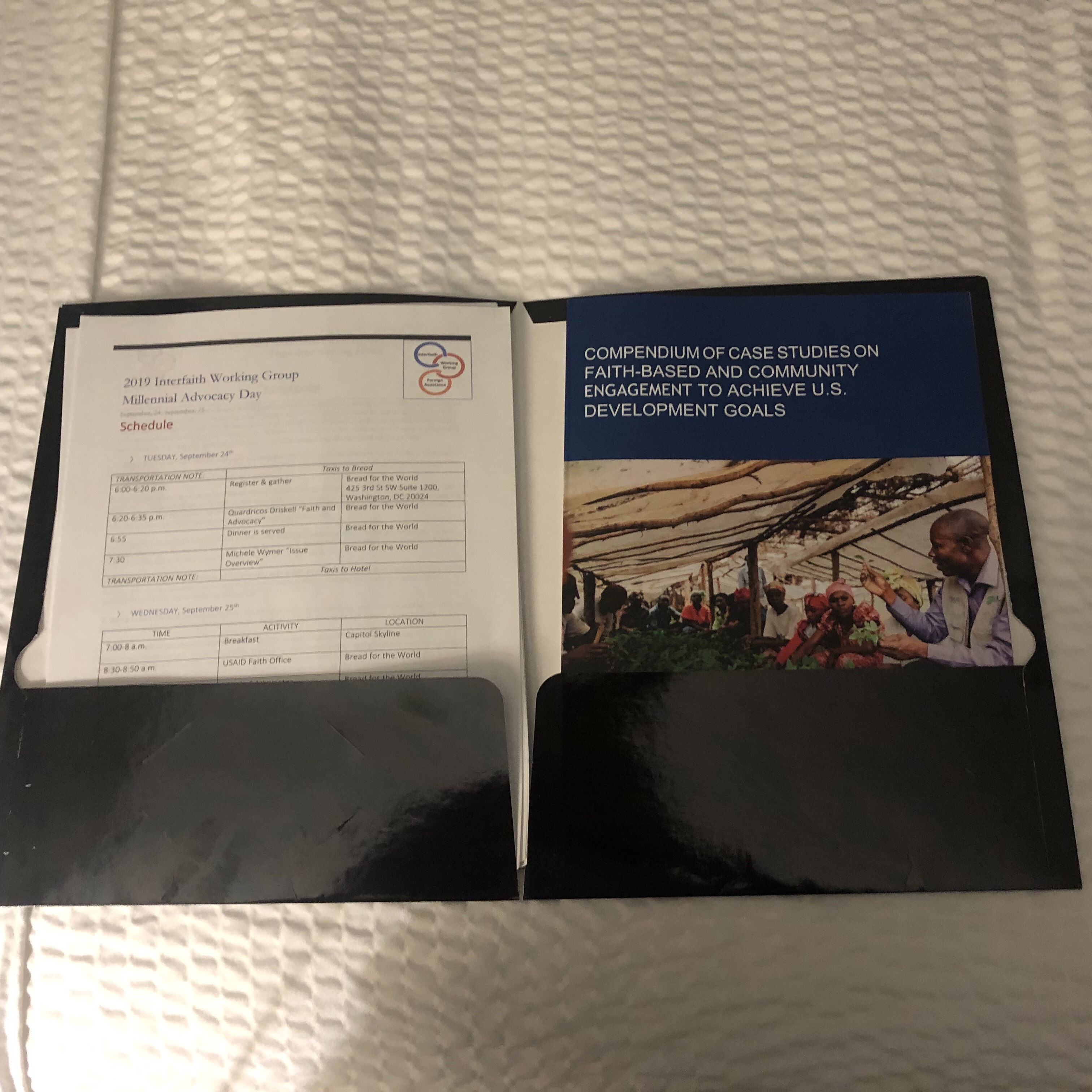 Picture of a folder with various papers in it related to trip