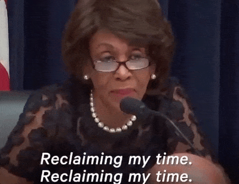 Picture of Maxine Waters with the words “reclaiming my time” written in white letters